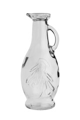 Jug for drinks made of transparent glass, paste with a narrow neck. Isolated on a white background, close-up