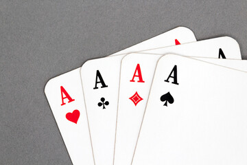 All four aces isolated on a gray background