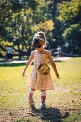 little child walking in the park in varna bapha bulgaria, model child shooting, autumn day 