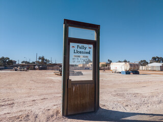 Bar door standing alone in the desert
