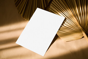 5x7 card mockup with sunlight shadows and dry palm leaf
