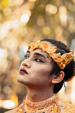 Portrait Of A Javanese Man Wearing A Gold Crown And Gold Necklace In Makeup Shirtless