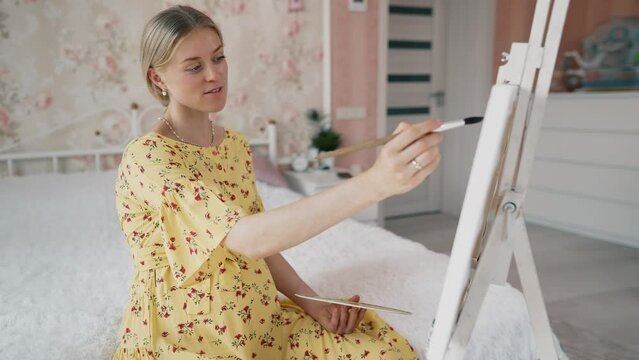 Pregnant woman drawing a picture