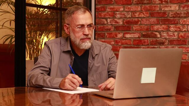 Portrait of practiced profesional elderly psychologist online remote session