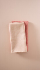 two pink towels on a pink background