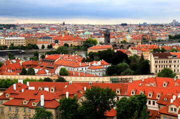 Fototapeta na wymiar Prague, Czech Republic. Mala Strana, Lesser Town of Praha. Top view, panorama. Ancient old house with red tiled roofs, tower, castle