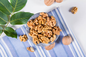 Мarble bowl filled with shelled walnuts