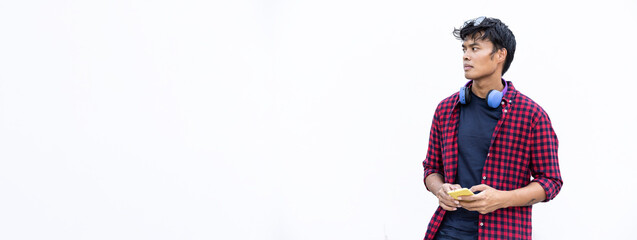 Horizontal banner or header with isolated young asiatic man using mobile smart phone on a white background - Generation z and millennial people always connected