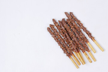 almond nut dark chocolate stick on white background 