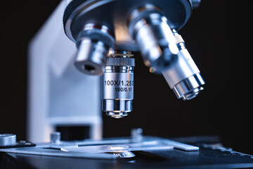 professional scientific equipment microscope for medicine scientist using in biotechnology science laboratory, biology or chemistry and medical technology research with microbiology experiment