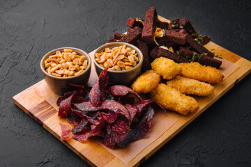Hot appetizer on wooden tray for beer