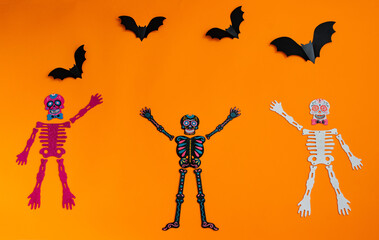 Happy Halloween holiday concept. Orange Halloween background design decorations, bats, patterns on...