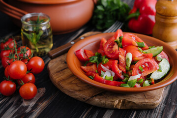 Tomato salad with cucumber, onion and parsley