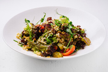 Fresh vegetarian salad with pearl barley and vegetables
