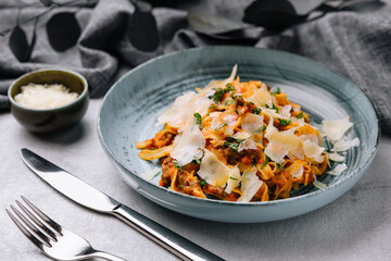 Tagliatelle with ragu bolognese sauce with parmesan © AntAlexStudio