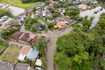 Fototapeta premium High-angle view of the Great Flood, Meng District, Thailand, on October 3, 2022, is a photograph from real flooding. With a slight color adjustment 