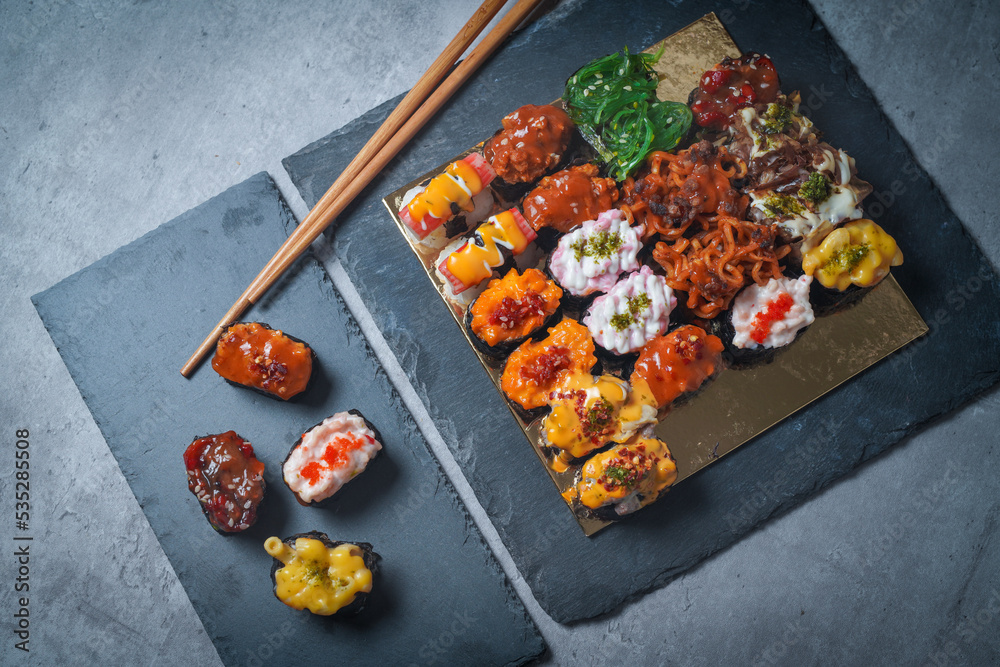 Wall mural Sushi is a Japanese dish of prepared vinegared rice (鮨飯, sushi-meshi), usually with some sugar and salt, accompanied by a variety of ingredients