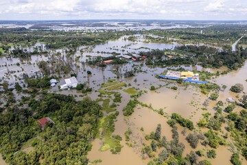 High-angle view of the Great Flood, Meng District, Thailand, on October 3, 2022, is a photograph from real flooding. With a slight color adjustment