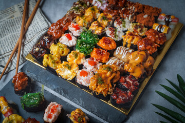 Sushi is a Japanese dish of prepared vinegared rice (鮨飯, sushi-meshi), usually with some sugar and salt, accompanied by a variety of ingredients