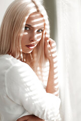 Fototapeta premium close-up of a young business woman standing near a window