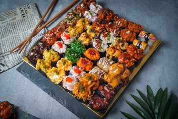 Sushi is a Japanese dish of prepared vinegared rice (鮨飯, sushi-meshi), usually with some sugar and salt, accompanied by a variety of ingredients
