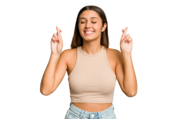 Young Indian woman isolated cutout removal background crossing fingers for having luck