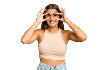 Young Indian woman isolated cutout removal background keeping eyes opened to find a success opportunity.