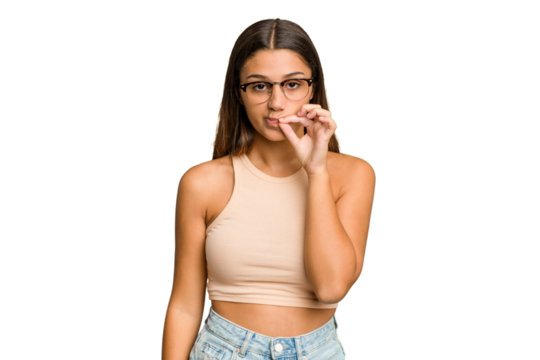 Young Indian woman isolated cutout removal background with fingers on lips keeping a secret.