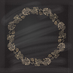 Vintage floral frame on a chalkboard background.