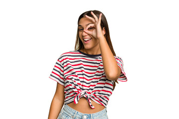 Young Indian woman isolated cutout removal background excited keeping ok gesture on eye.