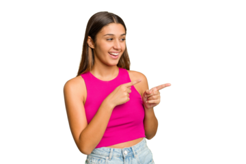 Young Indian woman isolated cutout removal background points with thumb finger away, laughing and carefree.