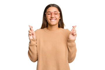 Young Indian woman isolated cutout removal background crossing fingers for having luck