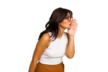 Young Indian woman isolated on green chroma background is saying a secret hot braking news and looking aside