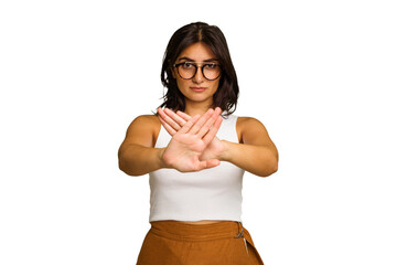 Young Indian woman isolated on green chroma background standing with outstretched hand showing stop...