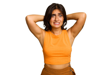 Young Indian woman isolated on green chroma background screaming with rage.