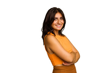 Young Indian woman isolated on green chroma background who feels confident, crossing arms with...