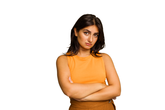 Young Indian woman isolated on green chroma background who is bored, fatigued and need a relax day.