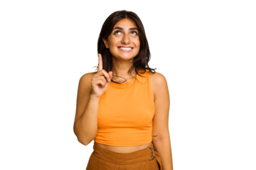 Young Indian woman isolated on green chroma background indicates with both fore fingers up showing a blank space.