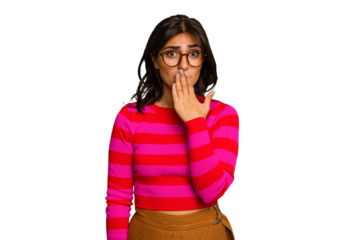 Young Indian woman isolated on green chroma background shocked, covering mouth with hands, anxious to discover something new.
