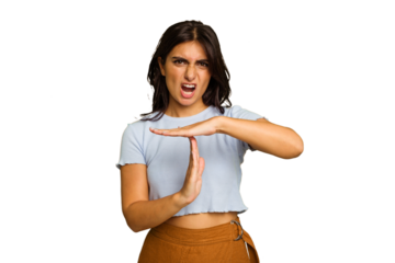 Young Indian woman isolated on green chroma background showing a timeout gesture.