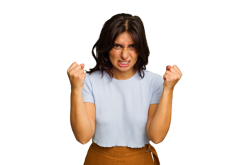 Young Indian woman isolated on green chroma background upset screaming with tense hands.