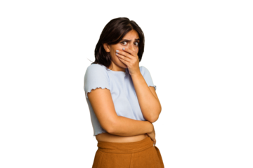 Young Indian woman isolated on green chroma background scared and afraid.