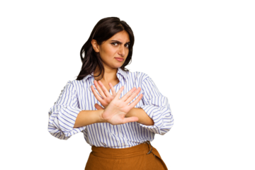 Young Indian woman isolated on green chroma background doing a denial gesture