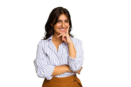Young Indian woman isolated on green chroma background smiling happy and confident, touching chin with hand.