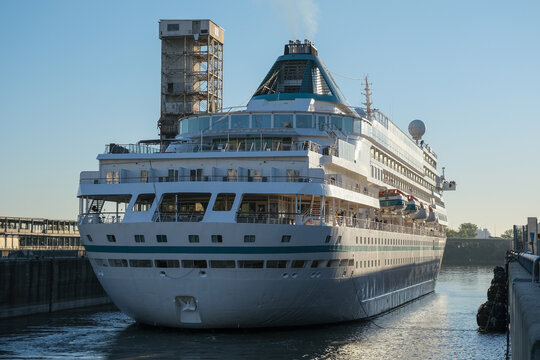 Phoenix cruiseship or cruise ship liner Amera in port of Montreal, Canada on sunny day on St. Lawrence River for Indian summer East Coast cruising with downtown skyline and terminal