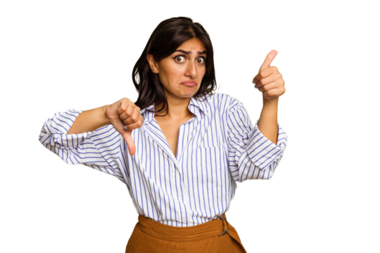 Young Indian woman isolated on green chroma background showing thumbs up and thumbs down, difficult choose concept