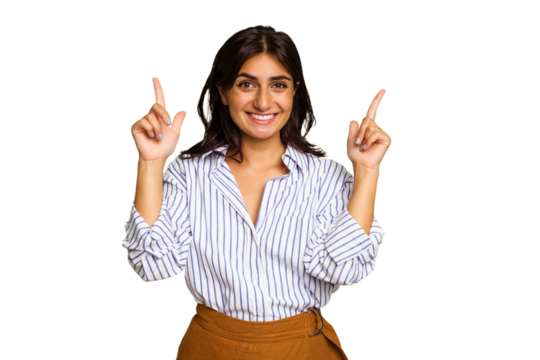 Young Indian woman isolated on green chroma background indicates with both fore fingers up showing a blank space.