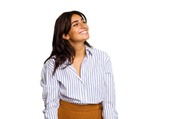 Young Indian woman isolated on green chroma background relaxed and happy laughing, neck stretched showing teeth.