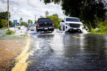 flooding the road until the car can't go., Meng District, Ubon Ratchathani Province, Thailand, on...