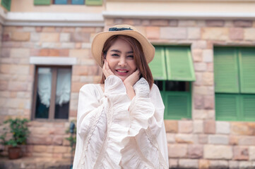 Fototapeta premium Asian woman traveling at the old town italy style,Alone travel,Lifestyle of single girl,View mountain with fog